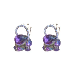 Elegant purple butterfly teardrop earrings with sparkling crystals and silver needles.