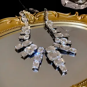 Statement bold square clear rhinestone necklace with dark metal frame on mirror