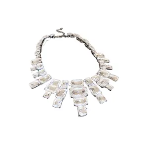 Elegant fashion statement necklace featuring bold rectangular clear crystals on a silver chain