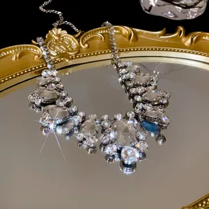 Detailed macro view of luxury rhinestone statement necklace with sparkling clear crystals