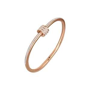 Minimalist rose gold titanium steel bangle with sparkling pave-set stones for women