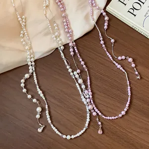 Elegant French-style beaded pearl necklaces with crystal accents and teardrop pendants.