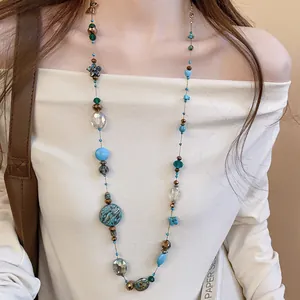 Vintage ethnic long necklace with colorful irregular glass beads and floral accents