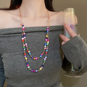 Close-up detail of multi-layered ethnic necklace with colorful irregular glass beads