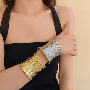Elegant wide metal cuff bracelets with embossed floral patterns in gold and silver finish