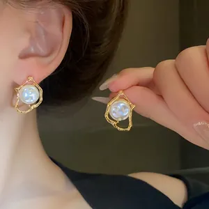 Stunning vintage irregular gold pearl stud earrings for women with elegant design