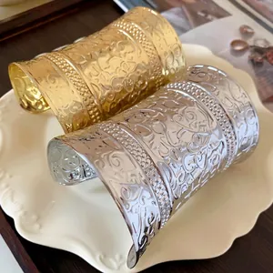 Elegant vintage embossed metal open cuff bracelets available in gold and silver finishes