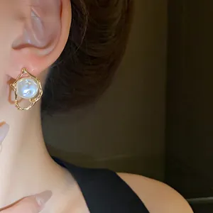 Vintage irregular gold-framed pearl stud earrings for women with 925 silver needles