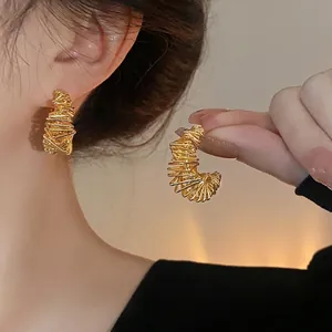 Elegant gold plated irregular hoop earrings with a unique wire-wrapped fashion design