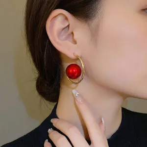 Vintage gold geometric hoop earrings with large red pearl bead for elegant women