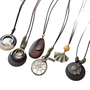 Set of vintage ethnic Bohemian long necklaces with wood and metal pendants for women