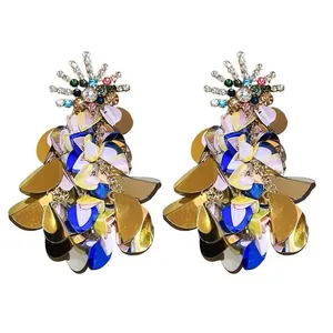 Statement resort style sequin earrings with colorful rhinestones on white background