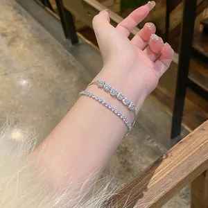Elegant silver-tone zircon crystal tennis bracelet set shown on a model's wrist