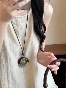 Retro ethnic style long bird necklace worn by woman, Zen bohemian sweater chain detail