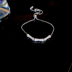 Detailed view of elegant silver bracelet featuring sparkling zircon bamboo joint charms