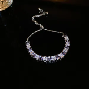 Elegant square zircon adjustable bracelet with lavender stones on black background.