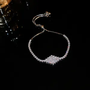 Sparkling zircon cluster on adjustable silver-tone drawstring bracelet detail