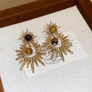 Vintage golden sunburst stud earrings with tiger eye stone and sparkling zircon accents