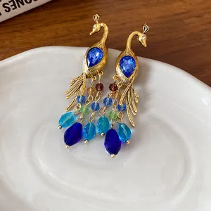 Pendientes de pavo real bohemios con diamantes de imitación azules y borlas de cuentas