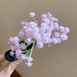 Close-up of pink flower cluster hair clip with sweet forest style design