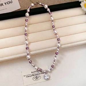 French style pearl necklace with a radiant square zircon pendant on a jewelry display
