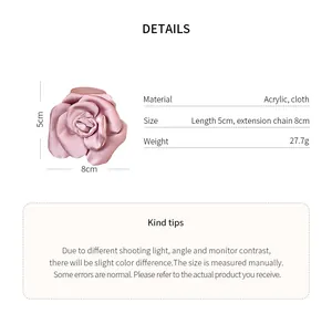 Detail view of a pink satin rose hair clip with dimensions and material info.
