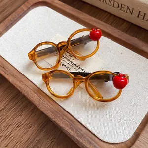 Stylish acrylic apple glasses-shaped hair clips in amber finish for a trendy look