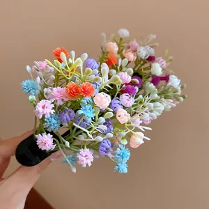 Detailed close-up showing the vibrant multi-colored flower cluster of this cute hair clip