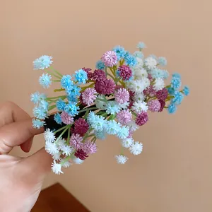 Close-up of a sweet floral cluster duckbill hair clip with blue and purple flowers