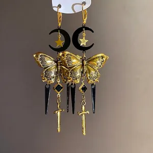 Antique style gold and black butterfly moon earrings featuring long fringe with sword charm