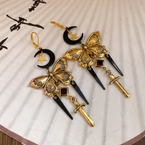 Vintage butterfly earrings with moon, star, and sword charms in gold and black finish