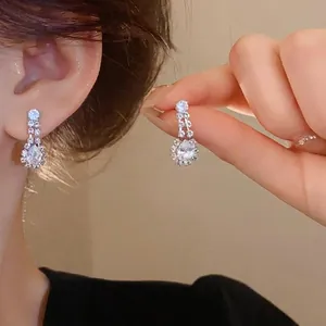 Elegant silver-colored waterdrop zircon dangle earrings for women in light luxury style
