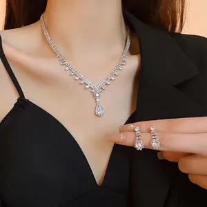 Detailed view of elegant waterdrop cubic zirconia necklace and earring set on model