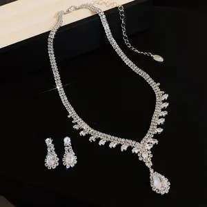 Elegant silver-toned necklace and earrings set featuring sparkling waterdrop zircons