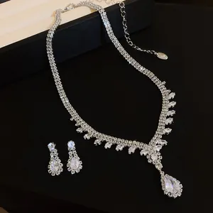 Detailed close-up of elegant French style water-drop zircon necklace and earrings set