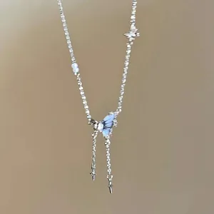 Elegant silver butterfly necklace with shining rhinestones and delicate pearls for women