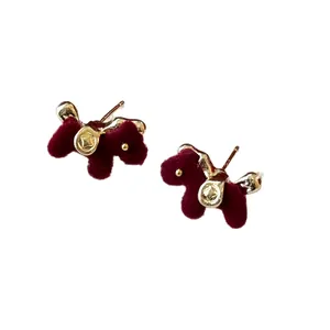 Elegant burgundy flocked horse stud earrings with gold accents and silver needle