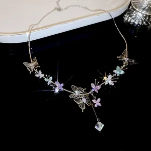 Exquisite gold-plated butterfly necklace featuring sparkling lavender and teal cubic zirconia details