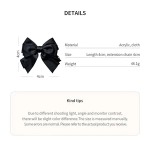 Large black cloth bow hair clip with 4cm measurements and material details
