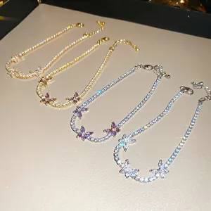 Vue détaillée de quatre bracelets tennis papillon en zircon en or et argent