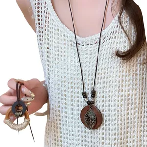 Bohemian ethnic style hollow leaf wooden round pendant necklace retro long sweater chain