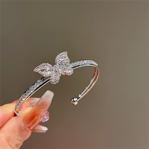 Detailed close-up view of a sparkling butterfly open cuff bracelet with zircon pavé
