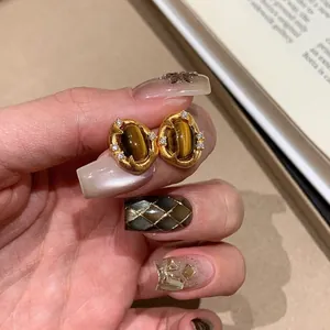 Vintage gold plated oval stud earrings with tiger eye stone and zircon accents for women