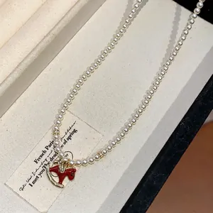 Elegant French style pearl necklace featuring a red enamel rocking horse pendant gift
