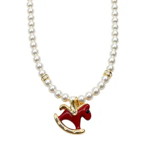 Elegant French style pearl necklace with a red enamel rocking horse pendant charm