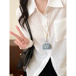 Cute dopamine blue leather mini purse pendant on long necklace for daily outfit detail
