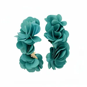 Elegant teal chiffon fabric flower C-shaped hoop earrings for a stylish beach vacation look.
