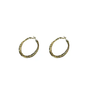 Elegant gold textured geometric hoop earrings with twisted minimalist design for women
