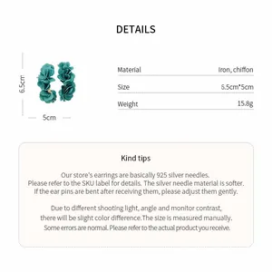 Close-up of dark green chiffon flower earrings showing material, size, and weight specs.