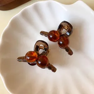 Elegant retro amber acrylic mini hair claw clips with round beads in Maillard style